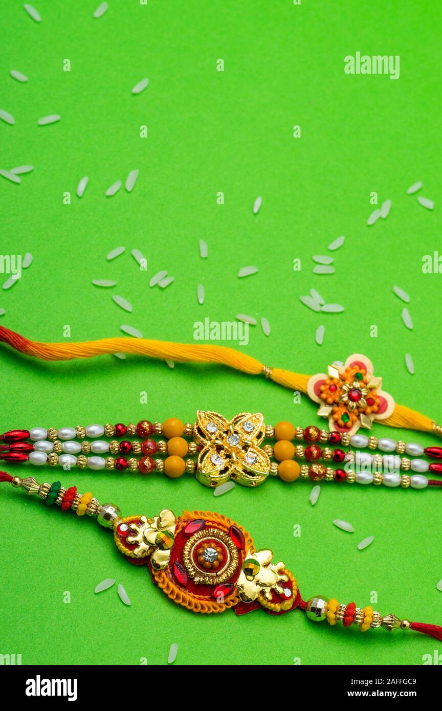 A Rakhi Raksha Bandhan background with an elegant Rakhi. A traditional Indian ...