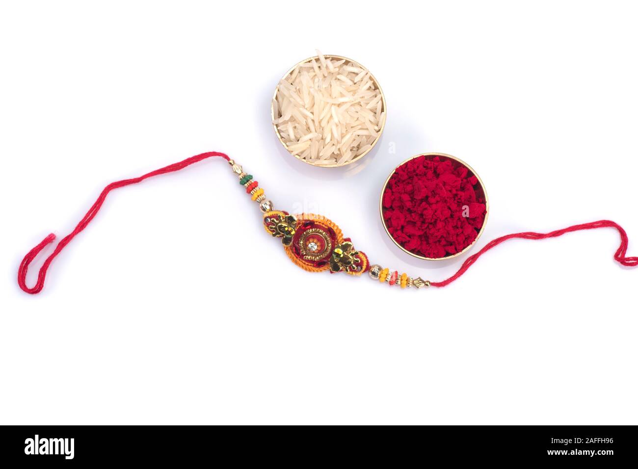 A Rakhi Indian festival: Raksha Bandhan background with an elegant Rakhi on a ...