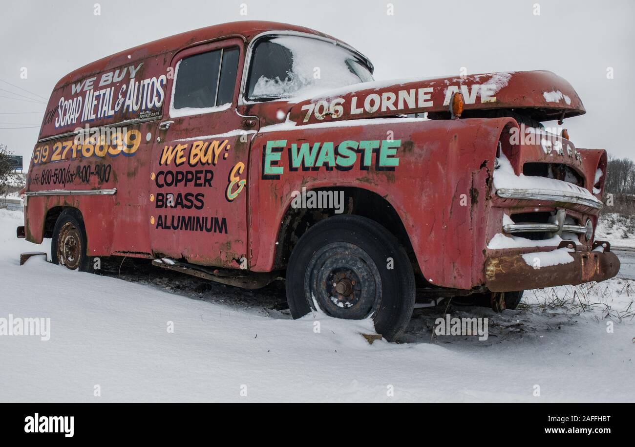 An old, wrecked Fargo vehicle owned by a metal buyandsell business