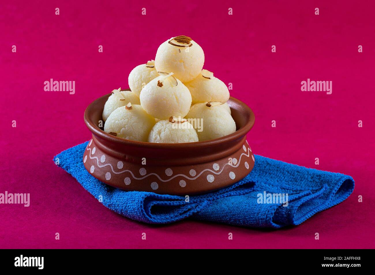 Indian Sweet - Rasgulla, Famous Bengali sweet in clay bowl with napkin ...