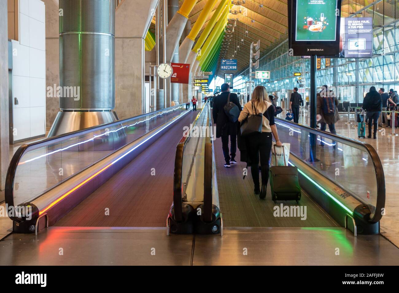 Moving walkways or travelators in Madrid-Barajas Adolfo Suárez Airport, Madrid, Spain help passengers get to their departure gates quickly. Stock Photo
