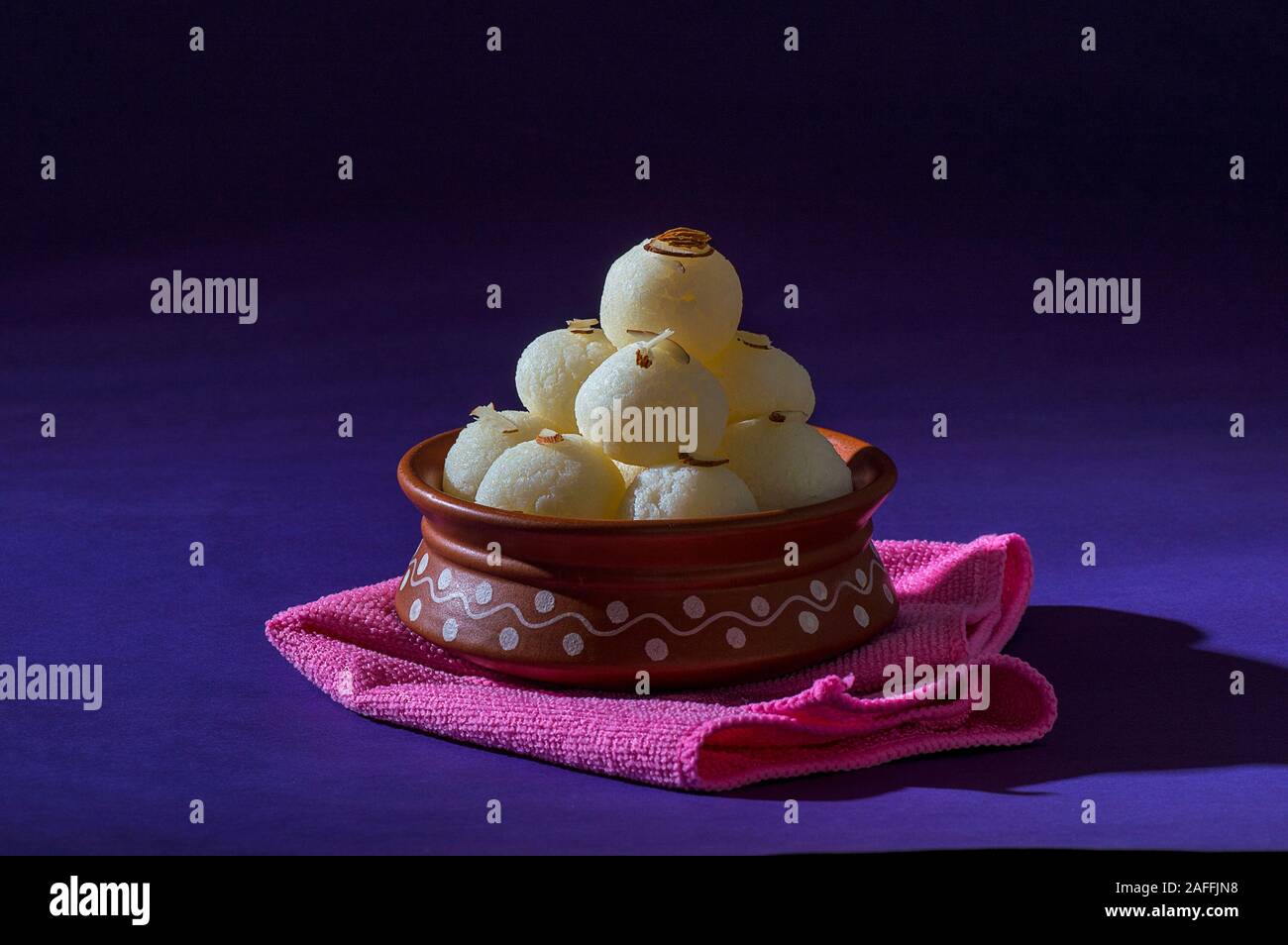 Indian Sweet or Dessert - Rasgulla, Famous Bengali sweet in clay bowl ...