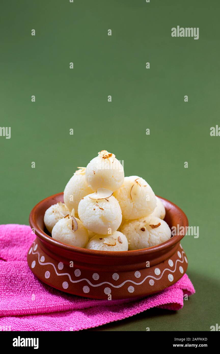 Indian Sweet - Rasgulla, Famous Bengali sweet in clay bowl with napkin ...