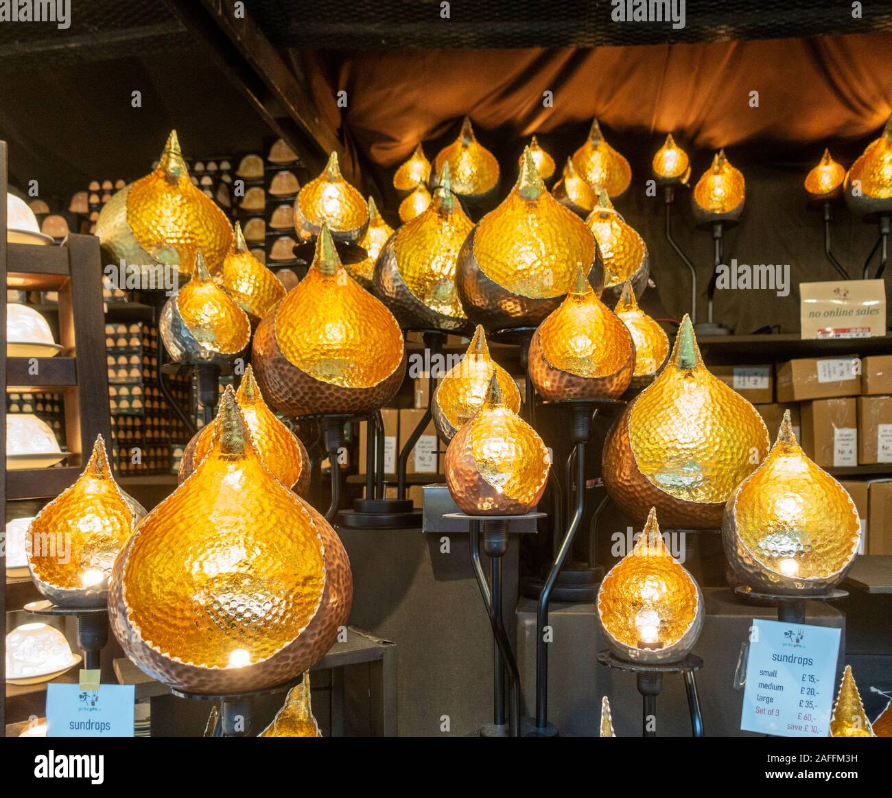 A display of different sizes of Sundrops tea-light holders in a market  stall in the Christmas Market in East Princes Street Gardens in Edinburgh  City Stock Photo - Alamy