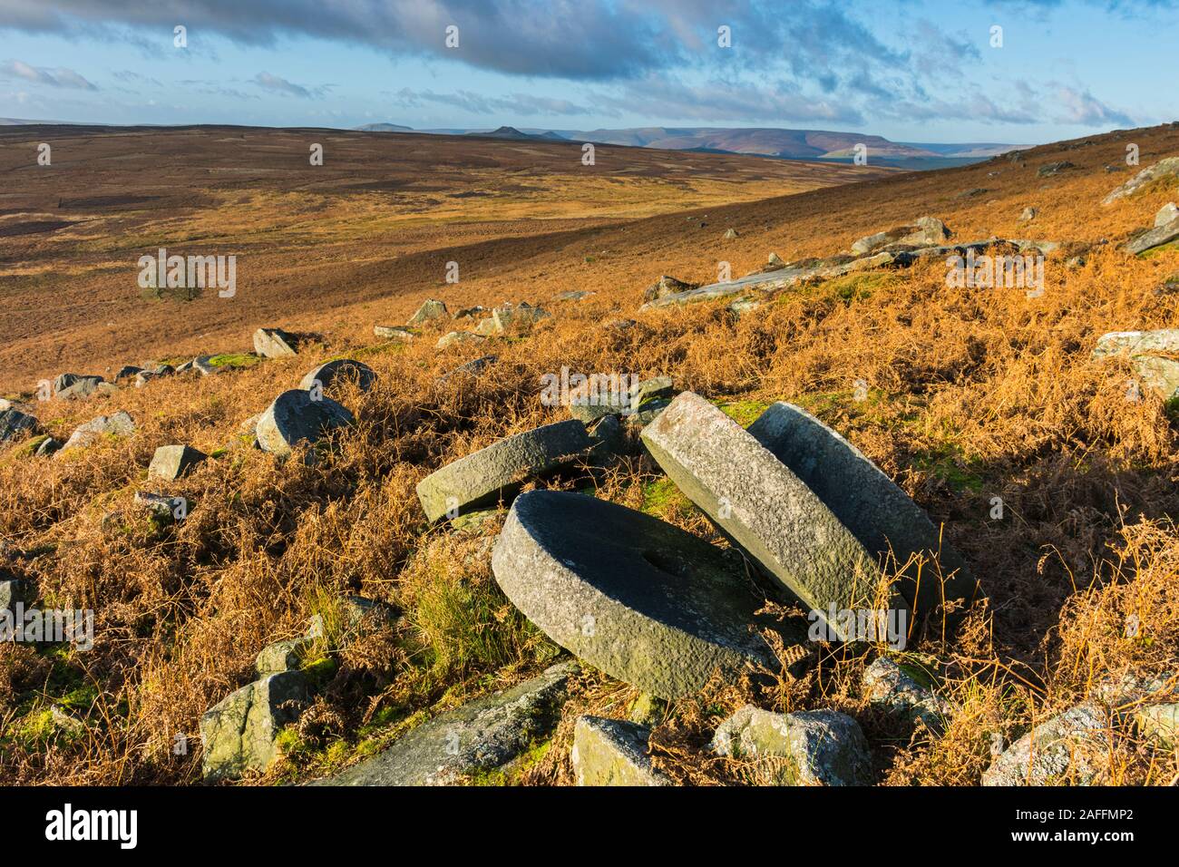 Abandoned millstones from former quarrying, below Stanage Edge. near Hathersage, Peak District, Derbyshire, England, UK. Stock Photo