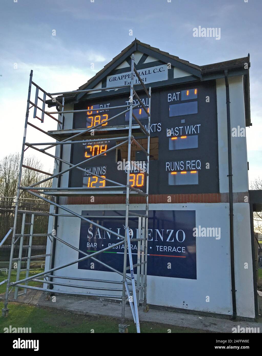 Grappenhall Cricket Club,Grappers, fitting new electronic scoreboard, replacing manual scoreboard, over 100 years old,Broad Lane,Warrington,WA4 Stock Photo