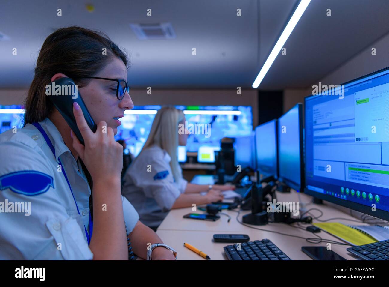 Technical Operator Works at His Workstation with Multiple Displays ...