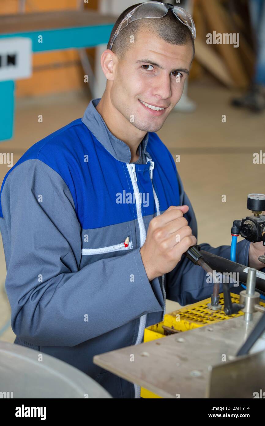 young mechanic in car service Stock Photo