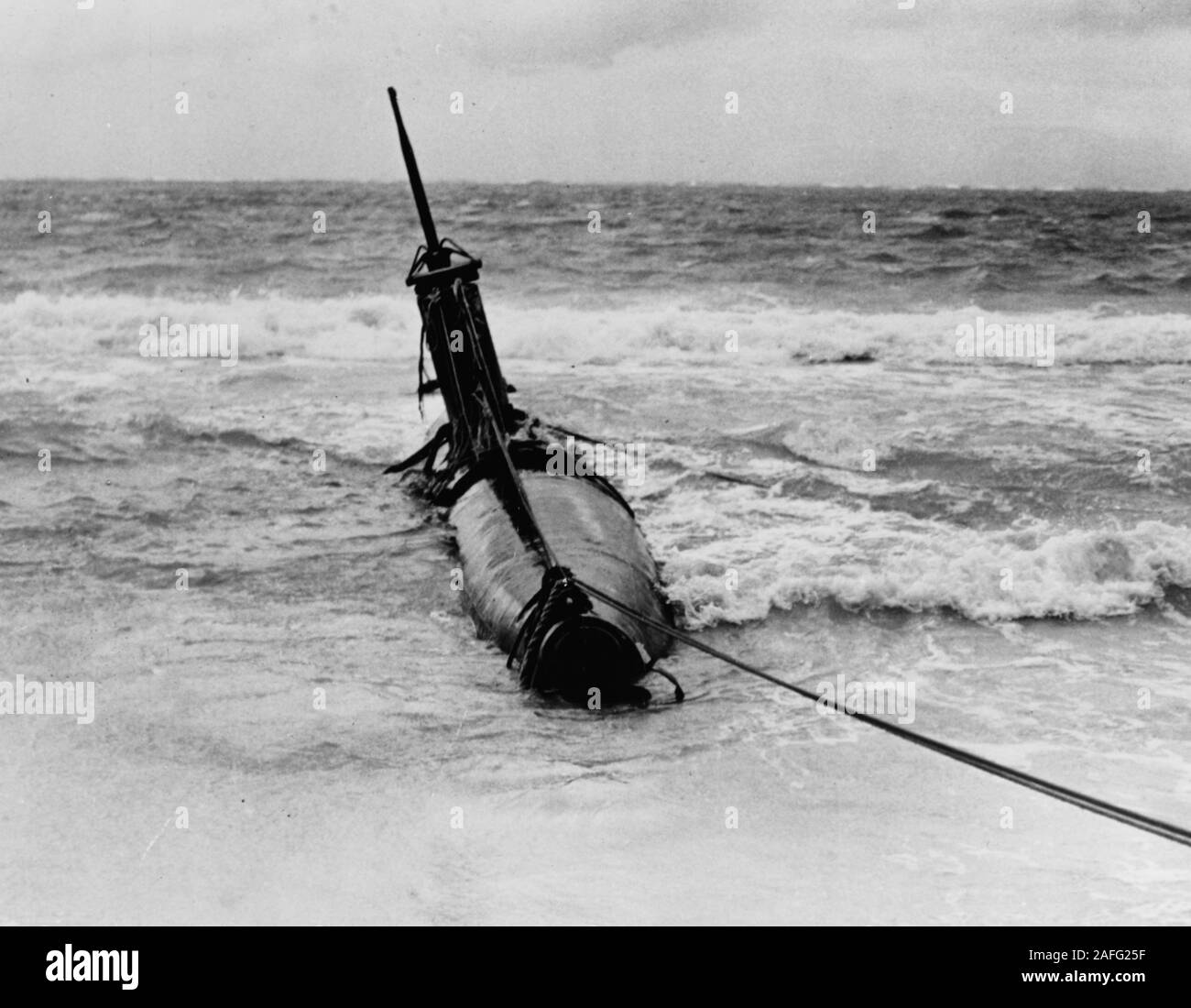 Japanese Type A midget submarine -  Beached in eastern Oahu after it grounded following attempts to enter Pearl Harbor during the 7 December 1941 Japanese attack. The photograph was taken on or shortly after 8 December 1941.  Copied in 1980 from Commander Submarine Squadron Four report, Serial 0570, of 26 December 1941. Stock Photo