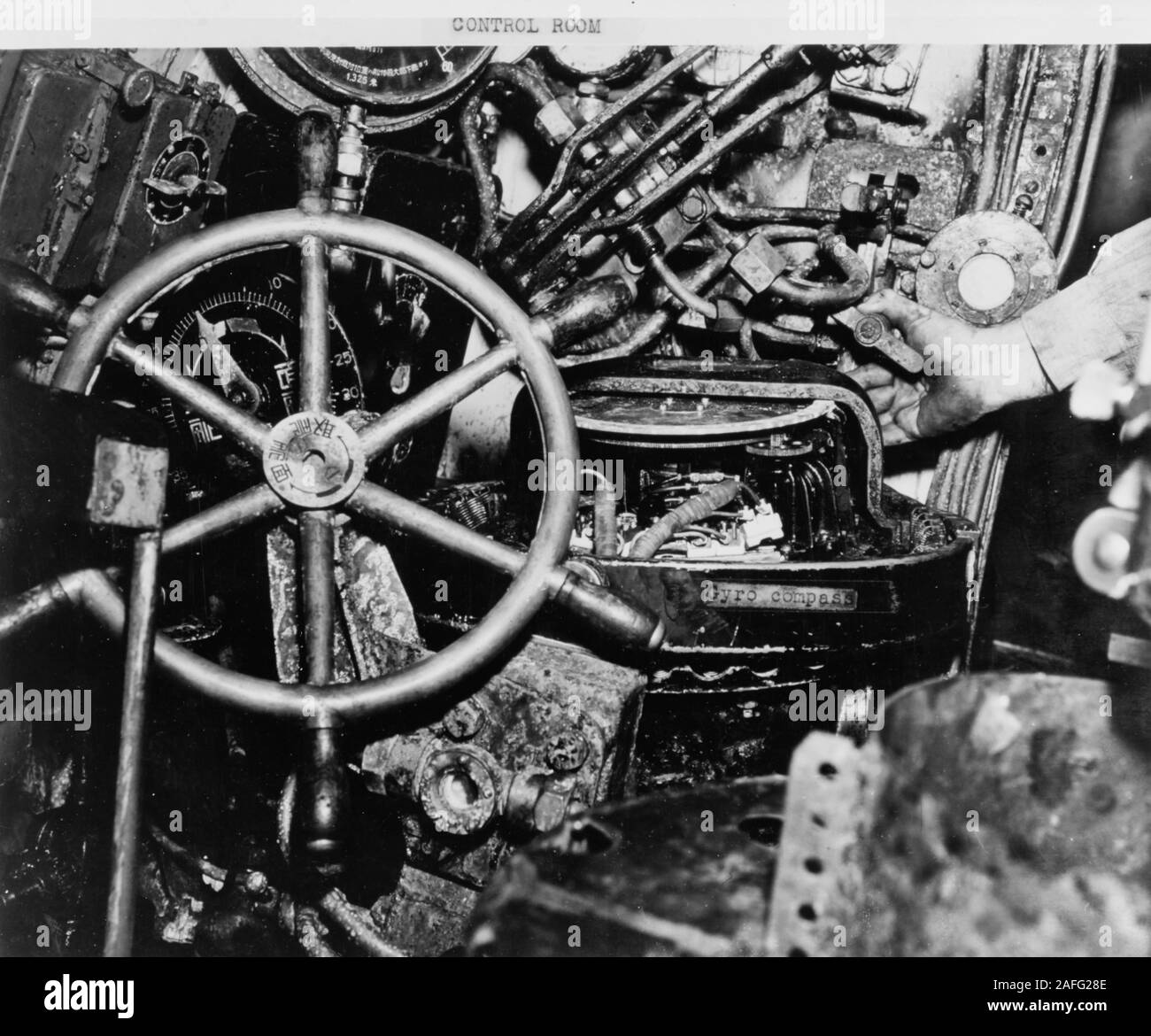 Japanese Type A midget submarine -  Annotated photograph of the the submarine's control room, showing a control wheel and the gyro compass (which was non-functional during her last mission), taken after salvage by U.S. forces, December 1941. HA-19 had grounded on 7 December 1941, following unsuccessful attempts to enter Pearl Harbor during the Japanese attack. Stock Photo