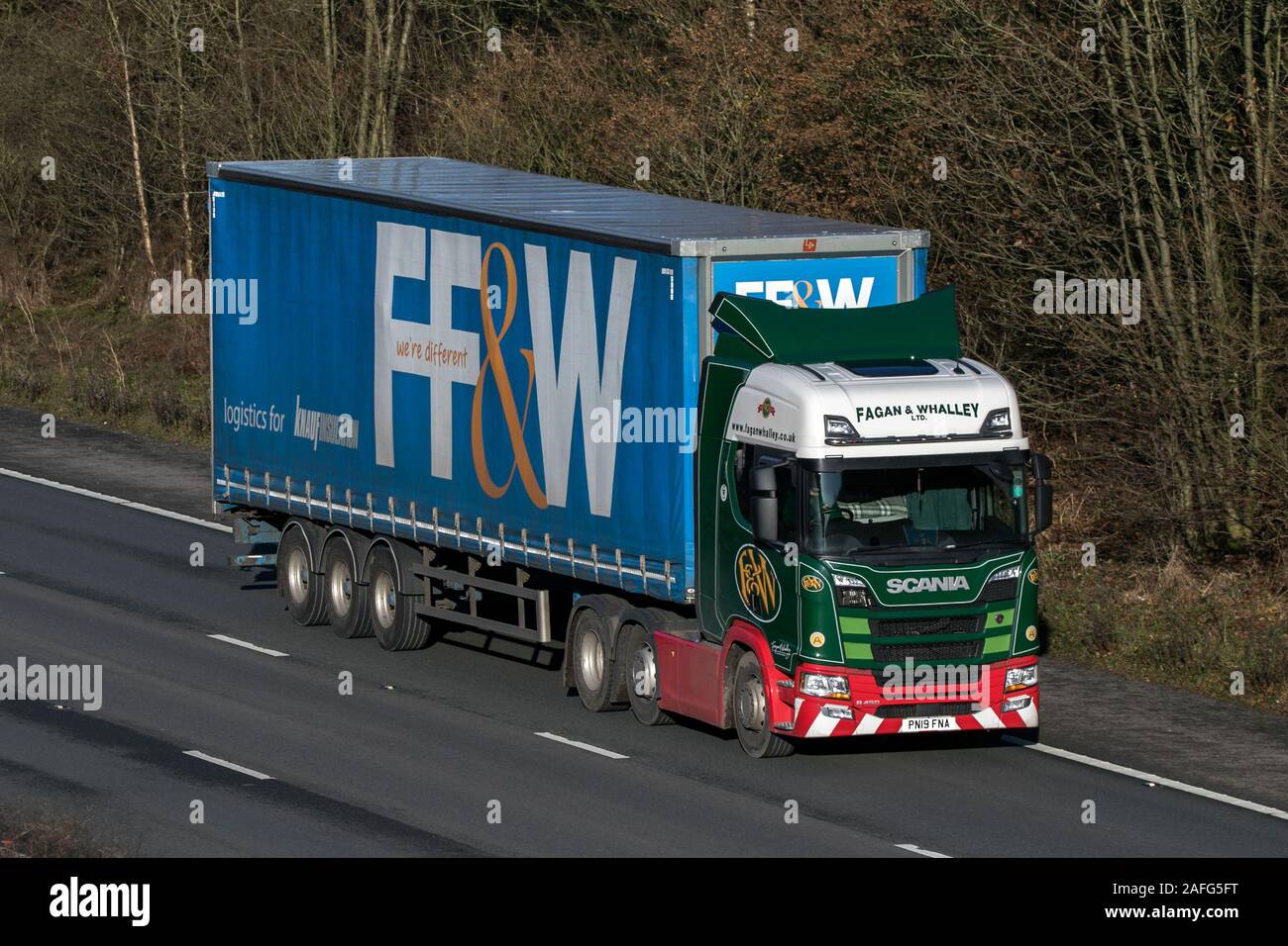 FF&W Haulage delivery trucks, lorry, transportation, truck, cargo carrier, Scania vehicle, commercial transport, industry, M6 at Lancaster, UK Stock Photo