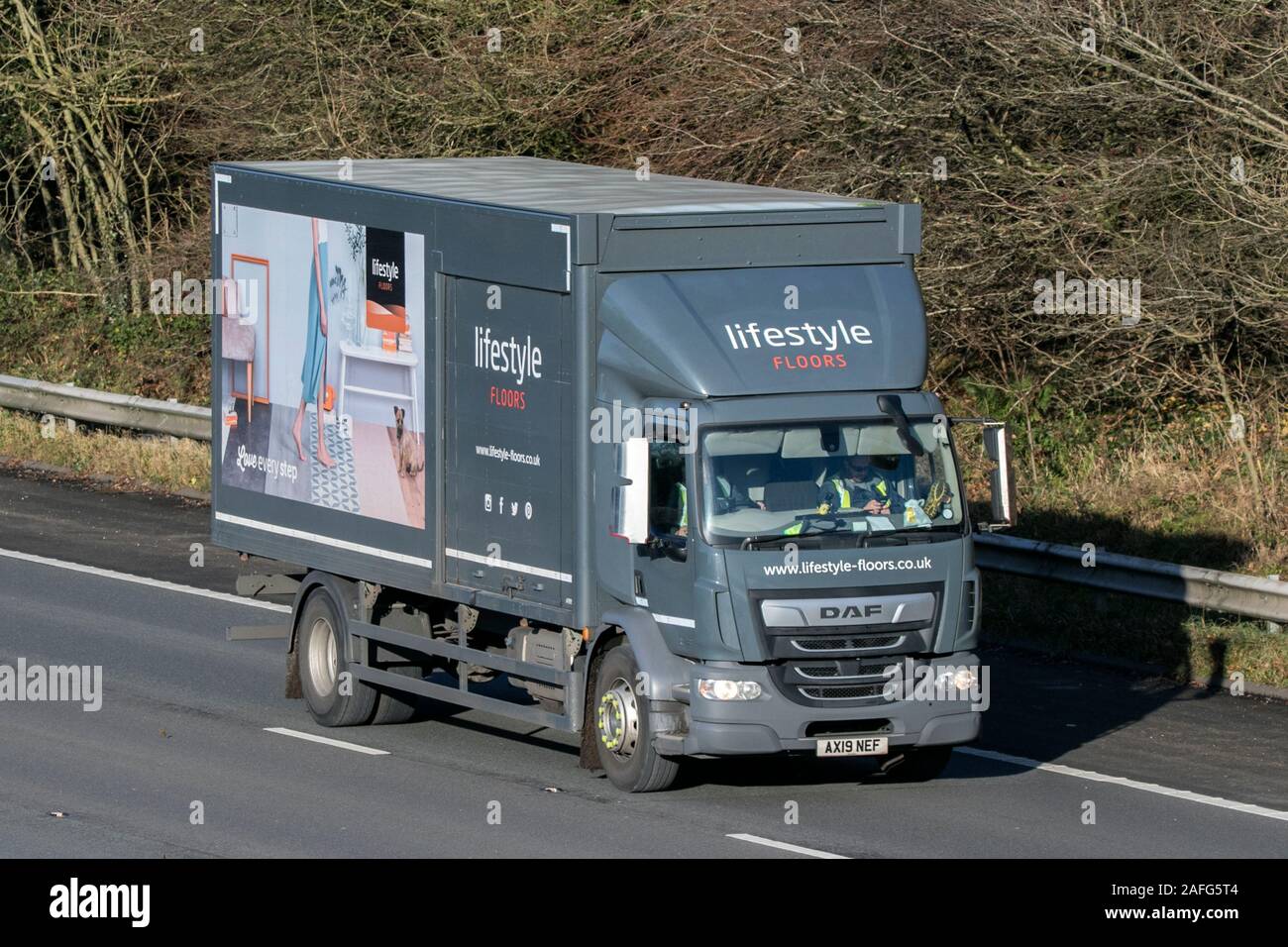 Lifestyle floors DAF rigid body truck driving on the M61 motorway near ...