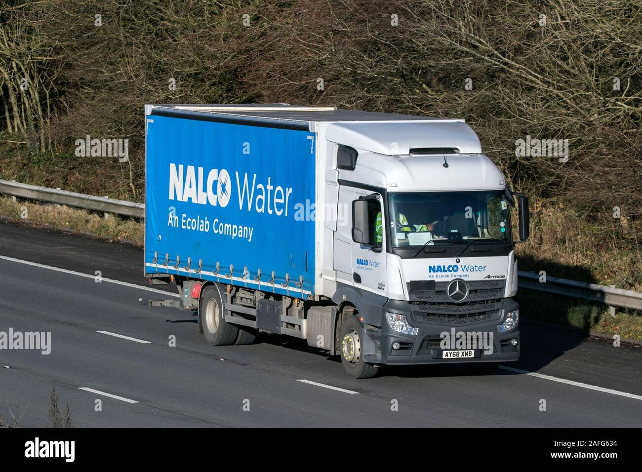 Nalco Water curtainsider driving on the M61 near Manchester, Uk Stock Photo