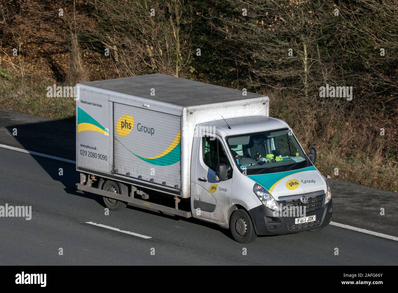 PHS Cleaning and Hygiene sanitary service vehicle driving on the M61 near Manchester, UK Stock Photo