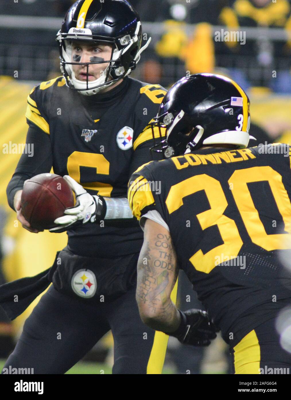 Pittsburgh, United States. 15th Dec, 2019. Pittsburgh Steelers quarterback Devlin Hodges (6) hands-off the ball to Pittsburgh Steelers running back James Conner (30) in the first quarter against the Buffalo Bills at Heinz Field in Pittsburgh on Sunday, December 15, 2019. Photo by Archie Carpenter/UPI Credit: UPI/Alamy Live News Stock Photo