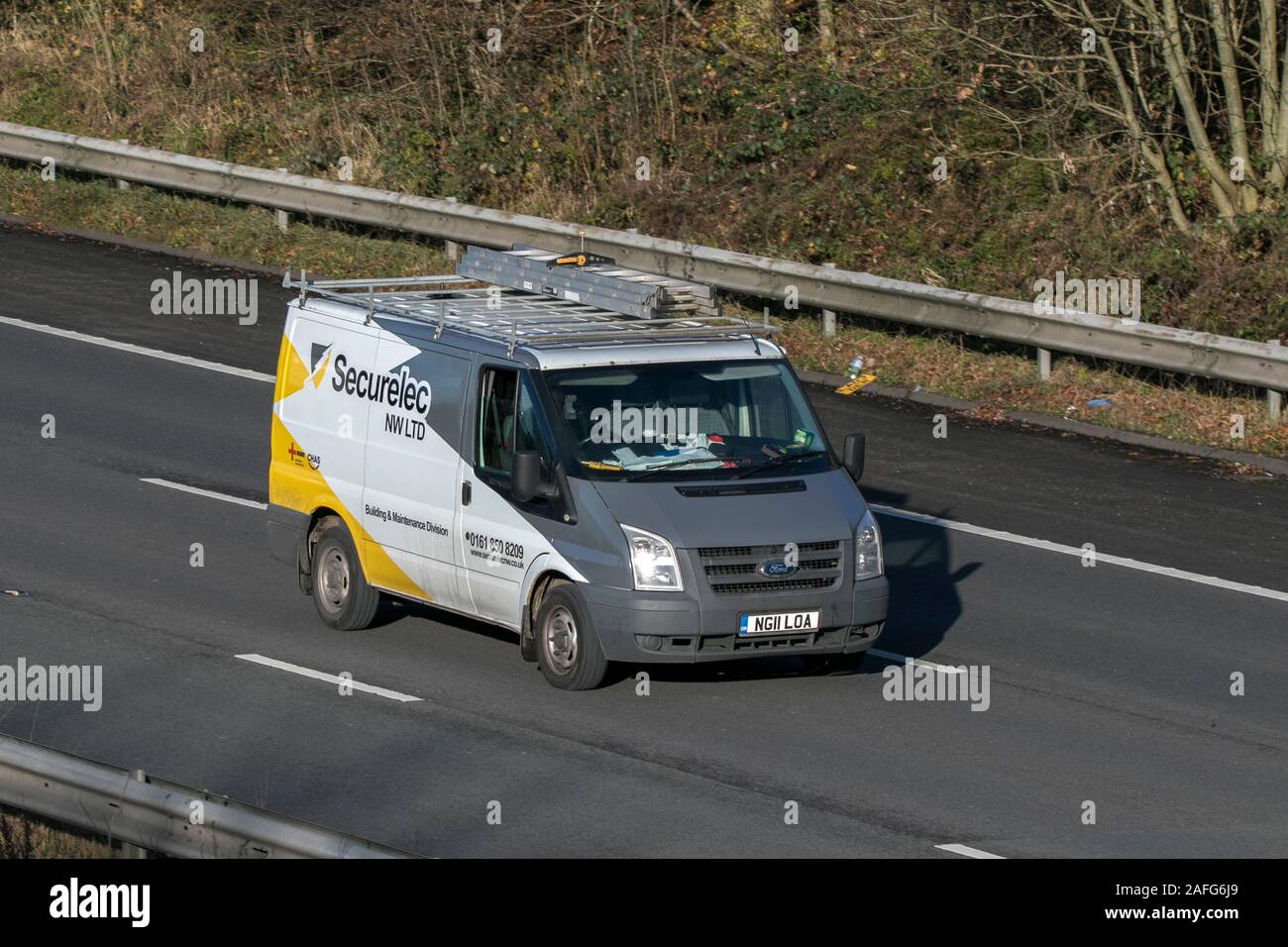 Securelec NW security and access control installer driving on the M61 near Manchester, UK Stock Photo