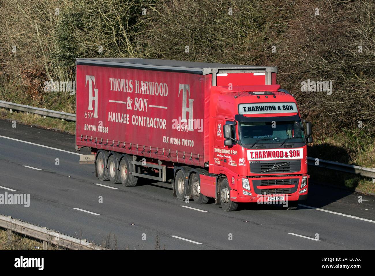 Thomas Harwood & Son Haulage delivery trucks, lorry, transportation, truck, cargo carrier, vehicle, commercial transport industry, M6 Lancaster, UK Stock Photo