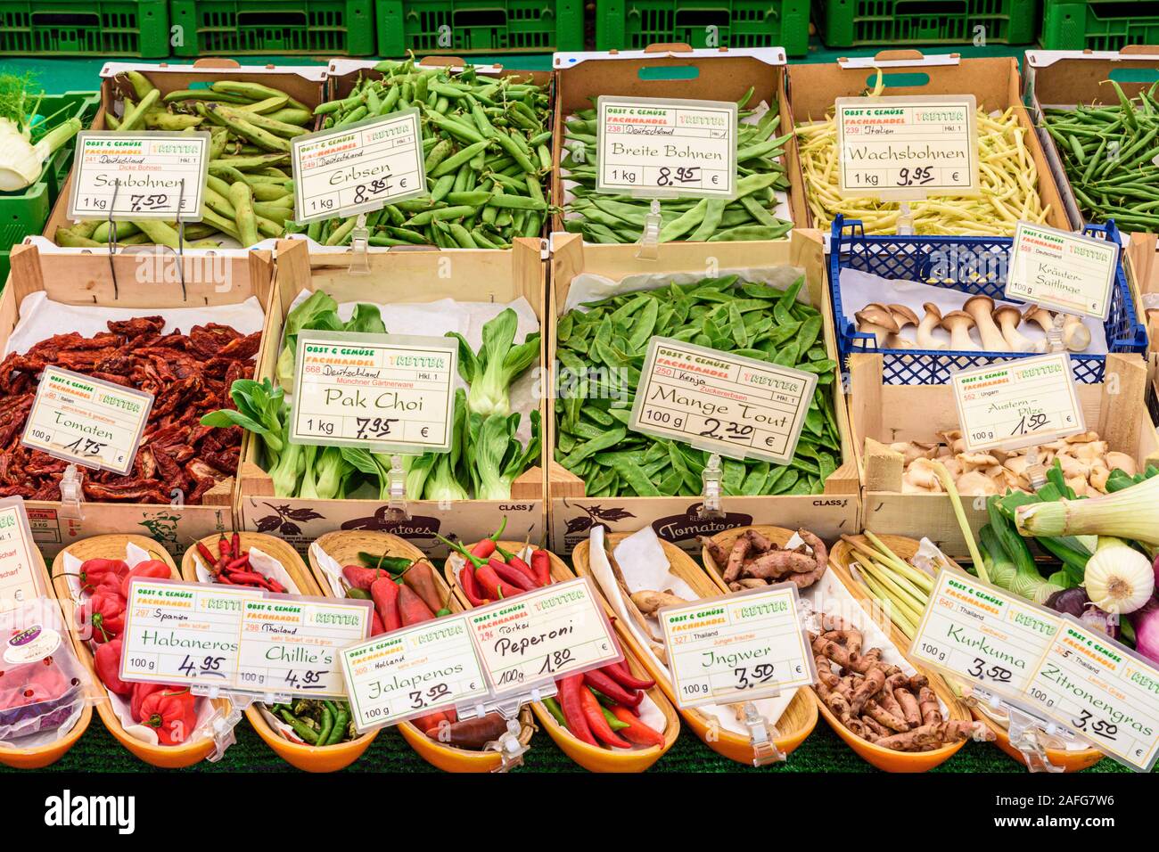 Boxes of fresh produce from around the world at a market stall in Munich, Germany Stock Photo