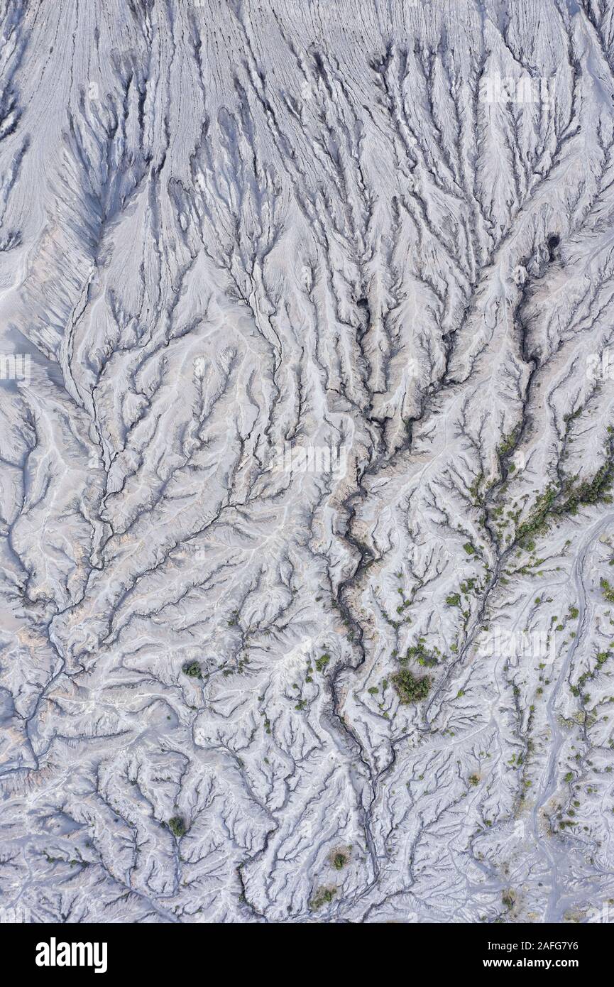 View from above, stunning aerial view of dried lava that forms a beautiful natural texture under the Mount Bromo. Cemoro Lawang, East Java, Indonesia. Stock Photo