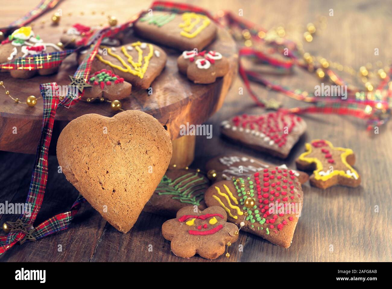 Home made Christmas cookies as a gift for family and friends on wooden table Stock Photo