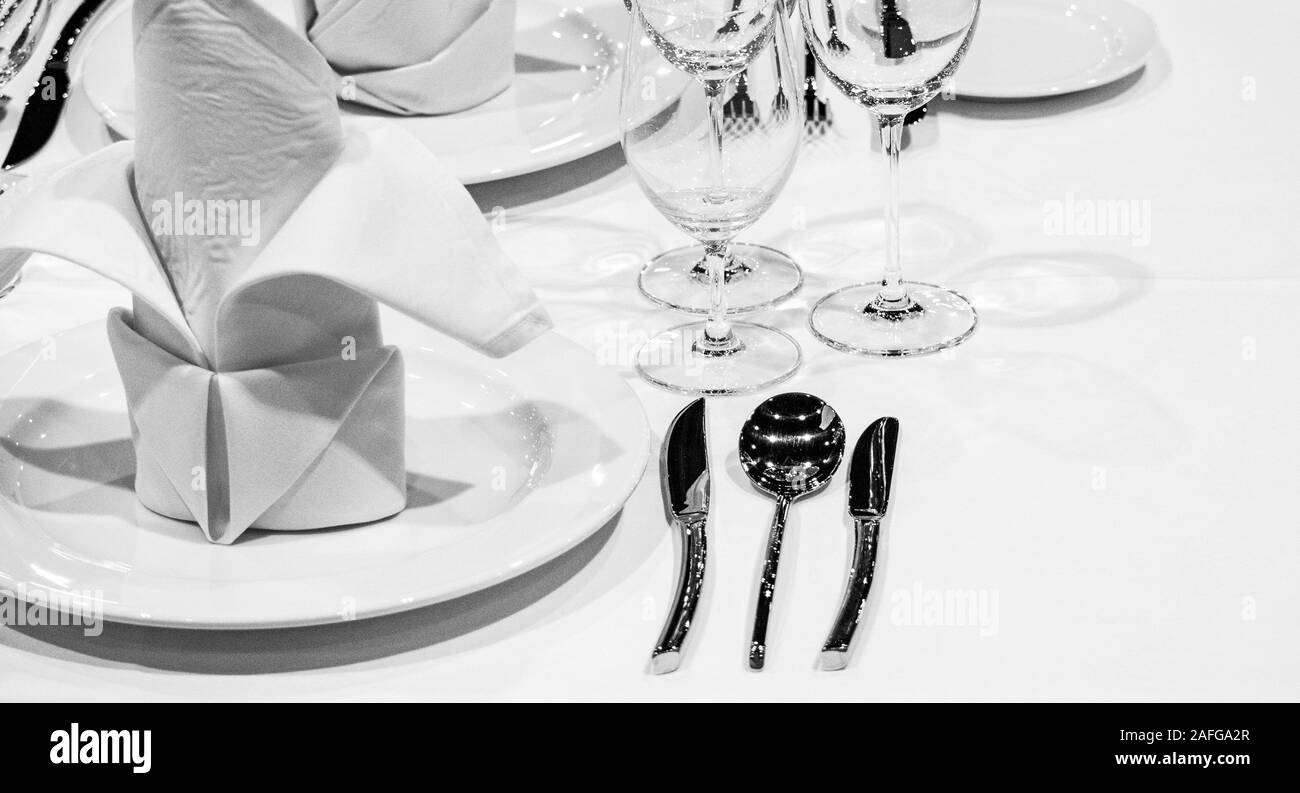 Table setting  Dinner plate in restaurant, black and white photo Stock Photo