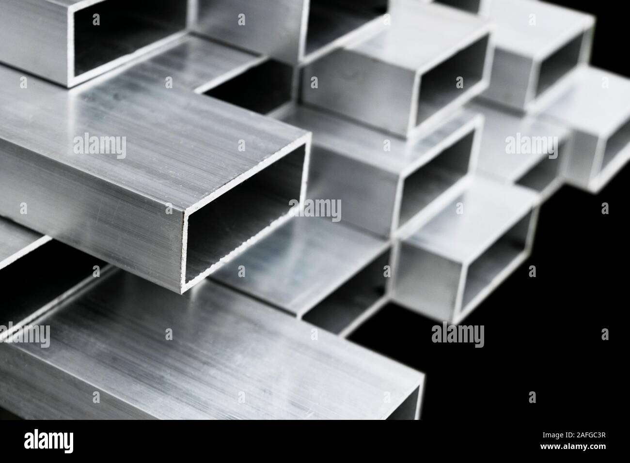 Aluminium profile for windows and doors manufacturing. Structural metal aluminium shapes. Aluminium profiles texture for constructions. Aluminum const Stock Photo