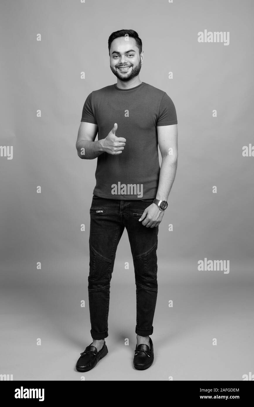 Indian guy full body studio Black and White Stock Photos & Images - Alamy