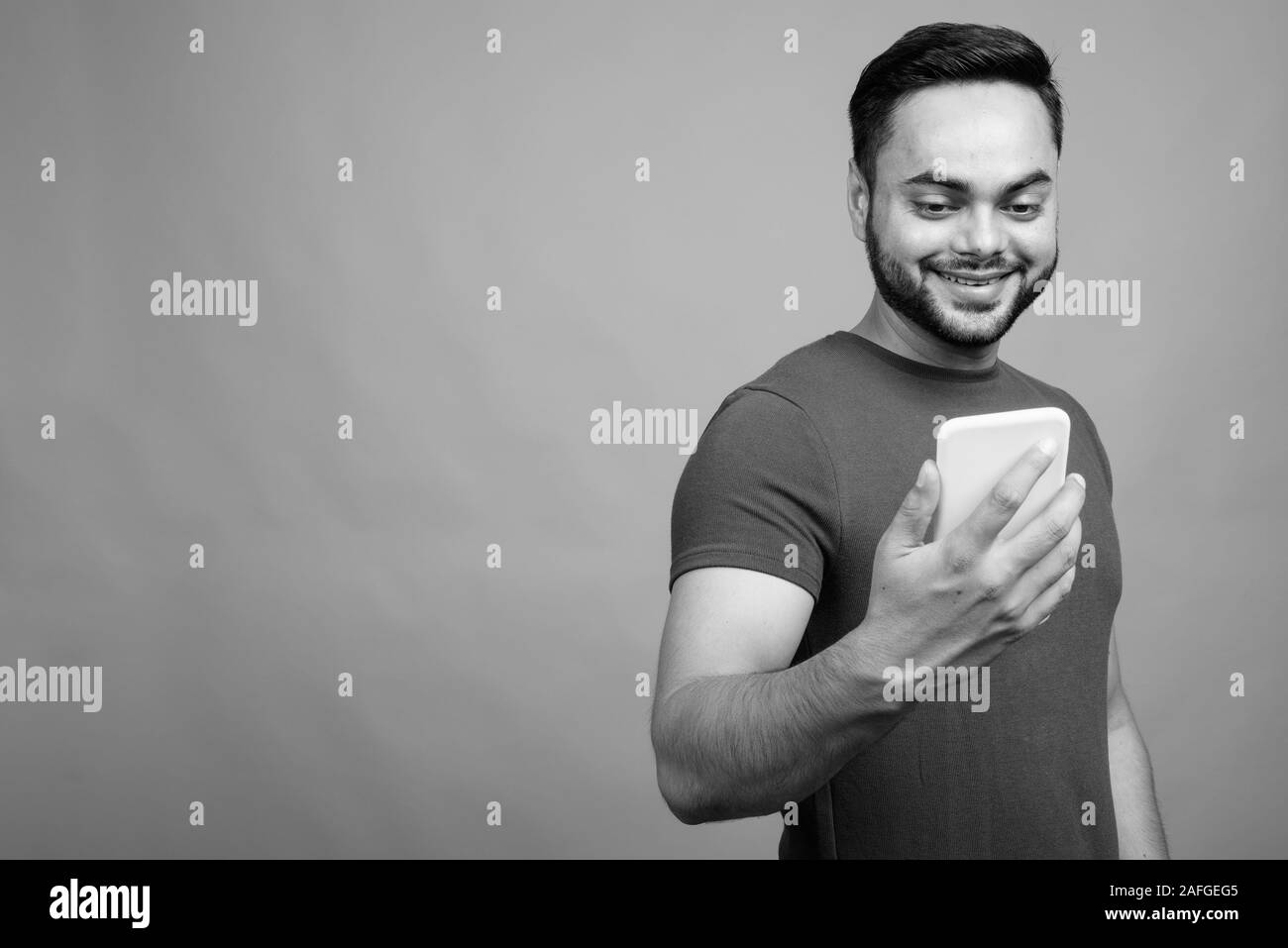 Young bearded indian man smartphone hi-res stock photography and images ...