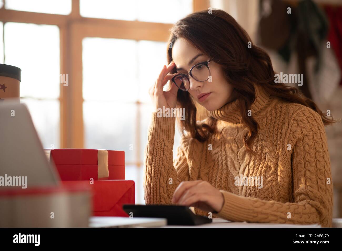 Young concentrated woman watching hi res stock photography and images
