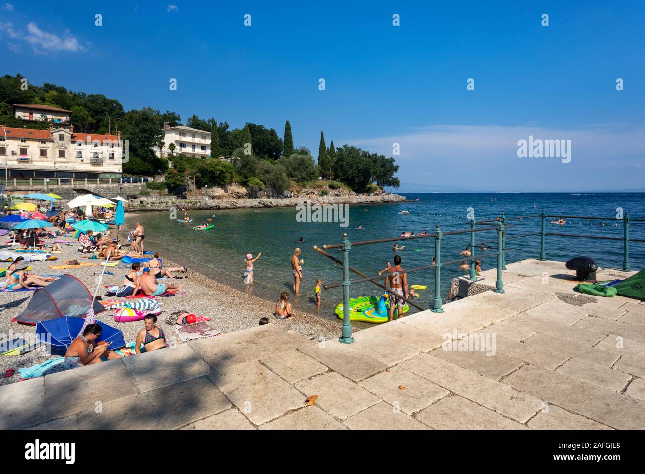People swimming on popular beach in place Ika near town Opatija, Kvarner,  Croatia Stock Photo - Alamy