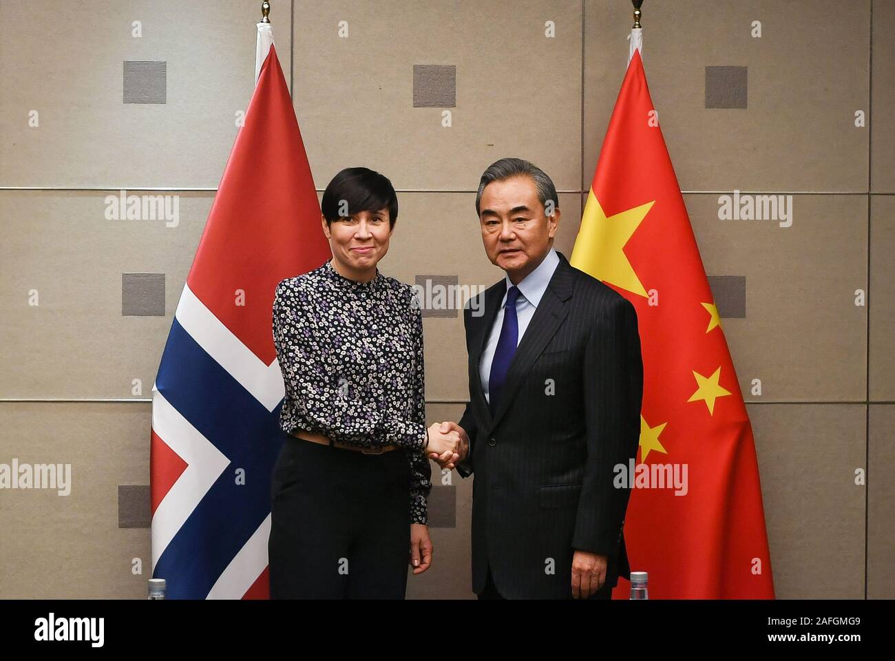 Madrid, Spain. 15th Dec, 2019. Chinese State Councilor and Foreign Minister Wang Yi (R) meets with Norwegian Foreign Minister Ine Eriksen Soreide on the sidelines of the 14th Foreign Ministers' Meeting of the Asia-Europe Meeting (ASEM) in Madrid, Spain, Dec. 15, 2019. Credit: Lu Yang/Xinhua/Alamy Live News Stock Photo
