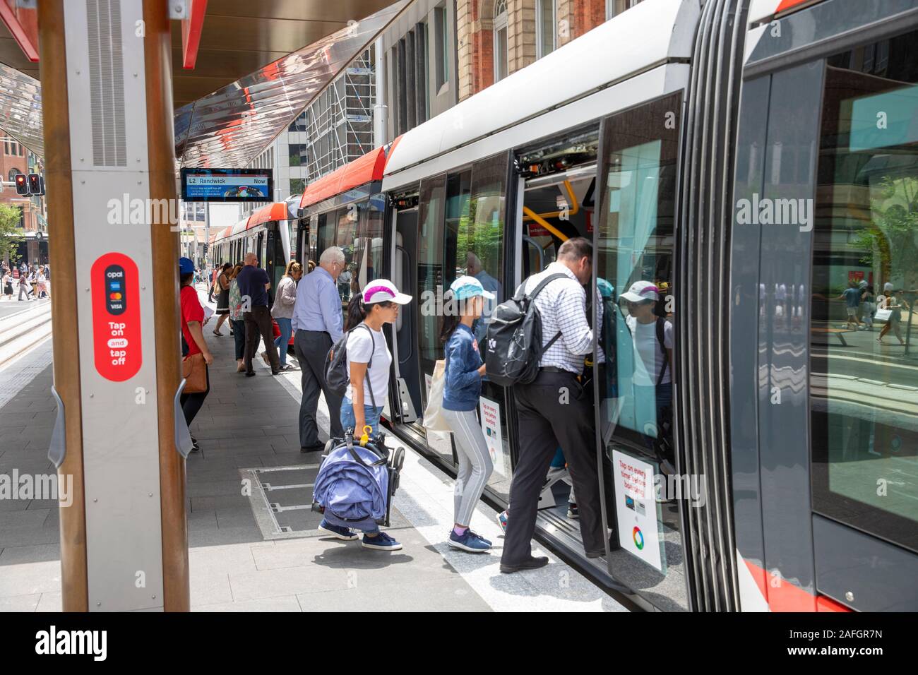 Sydney light rail tram, passengers wait for the light rail train on its