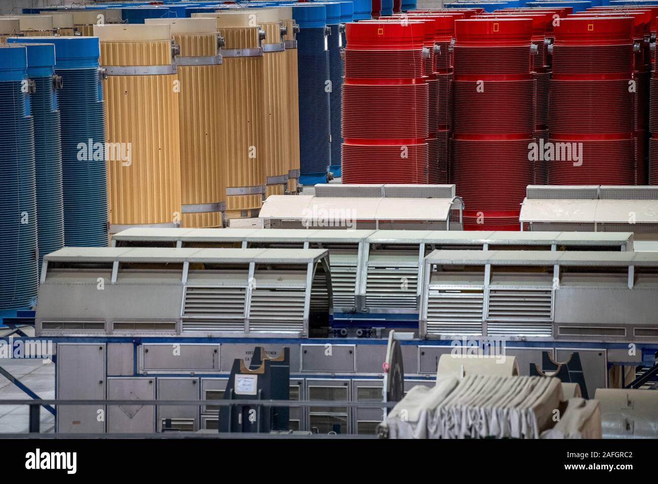 Gorleben, Germany. 11th Dec, 2019. Containers with high-level radioactive waste and transport hoods are in interim storage. The Gorleben nuclear waste storage facility is an interim storage facility for spent fuel elements and high-level radioactive waste. To date, 13 Castor transports with highly radioactive material have reached the transport container warehouse between 1995 and 2011. Until a repository has been found, the nuclear waste is to be temporarily stored there. Credit: Sina Schuldt/dpa/Alamy Live News Stock Photo