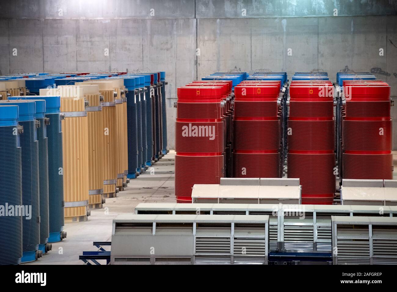 Gorleben, Germany. 11th Dec, 2019. Containers with high-level radioactive waste and transport hoods are in interim storage. The Gorleben nuclear waste storage facility is an interim storage facility for spent fuel elements and high-level radioactive waste. To date, 13 Castor transports with highly radioactive material have reached the transport container warehouse between 1995 and 2011. Until a repository has been found, the nuclear waste is to be temporarily stored there. Credit: Sina Schuldt/dpa/Alamy Live News Stock Photo