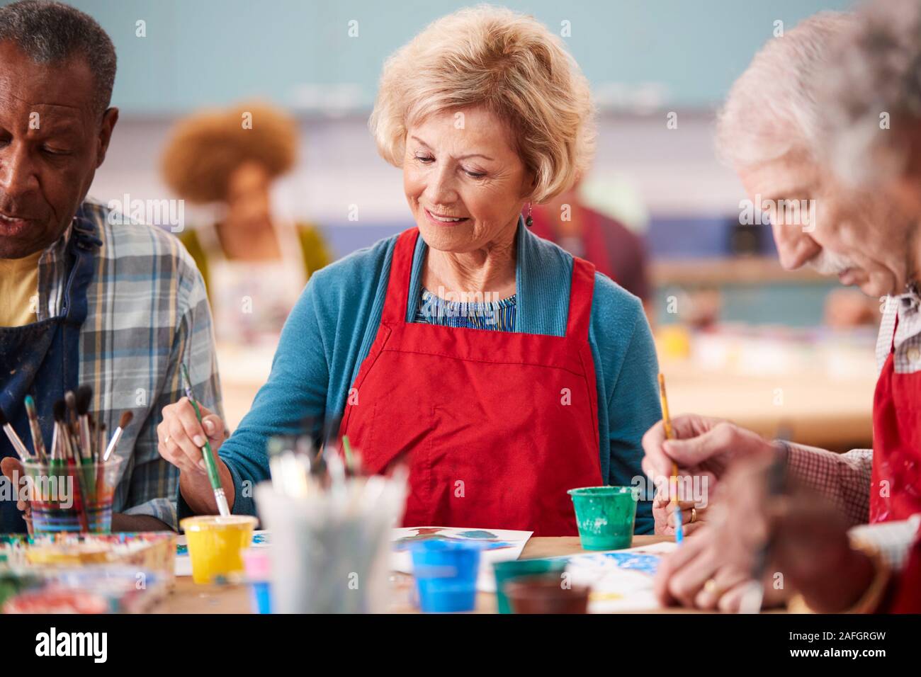Retired Senior Woman Attending Art Class In Community Centre Stock ...