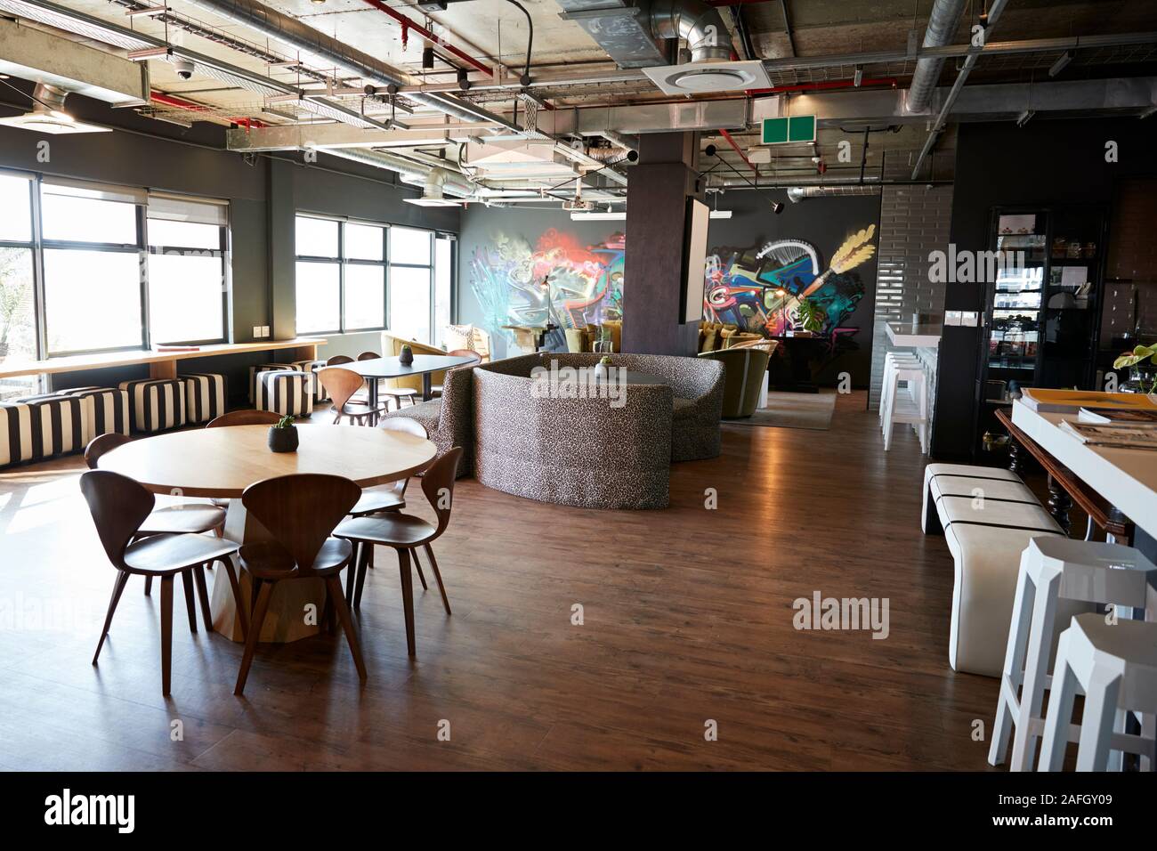 Eating and casual meeting area in the office of a creative business, daytime, no people Stock Photo