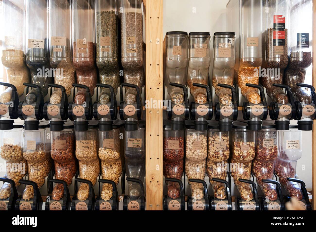 Dispensers For Nuts In Sustainable Plastic Free Grocery Store Stock Photo