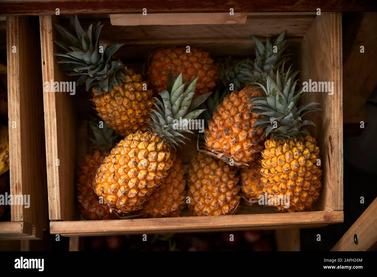 Display Of Pineapple In Sustainable Plastic Packaging Free Grocery Store Stock Photo