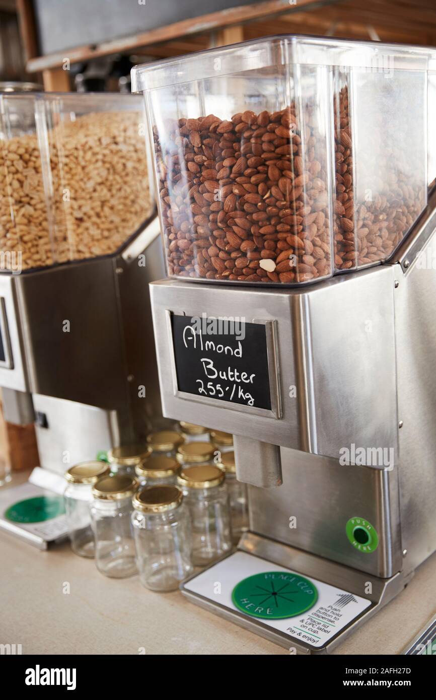 Dispensers For Almond Butter In Sustainable Plastic Free Grocery Store Stock Photo