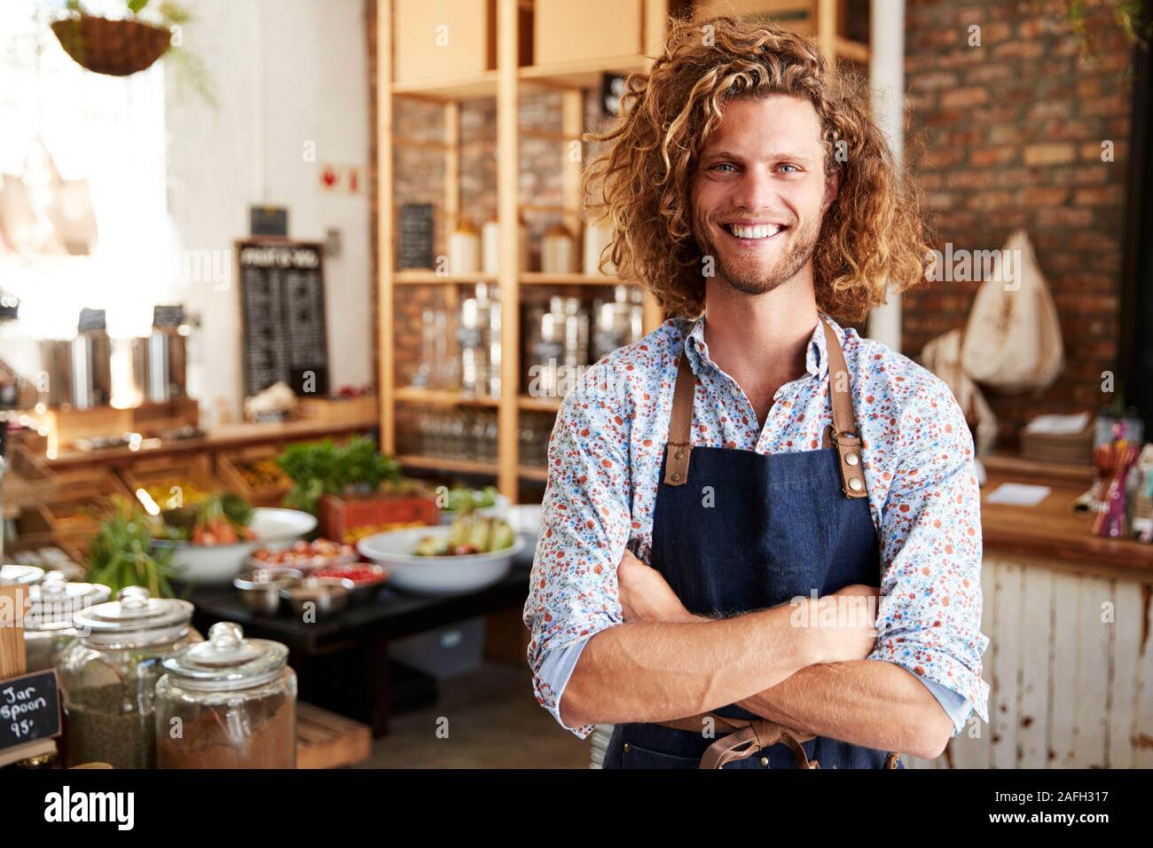 Portrait Of Male Owner Of Sustainable Plastic Free Grocery Store Stock Photo