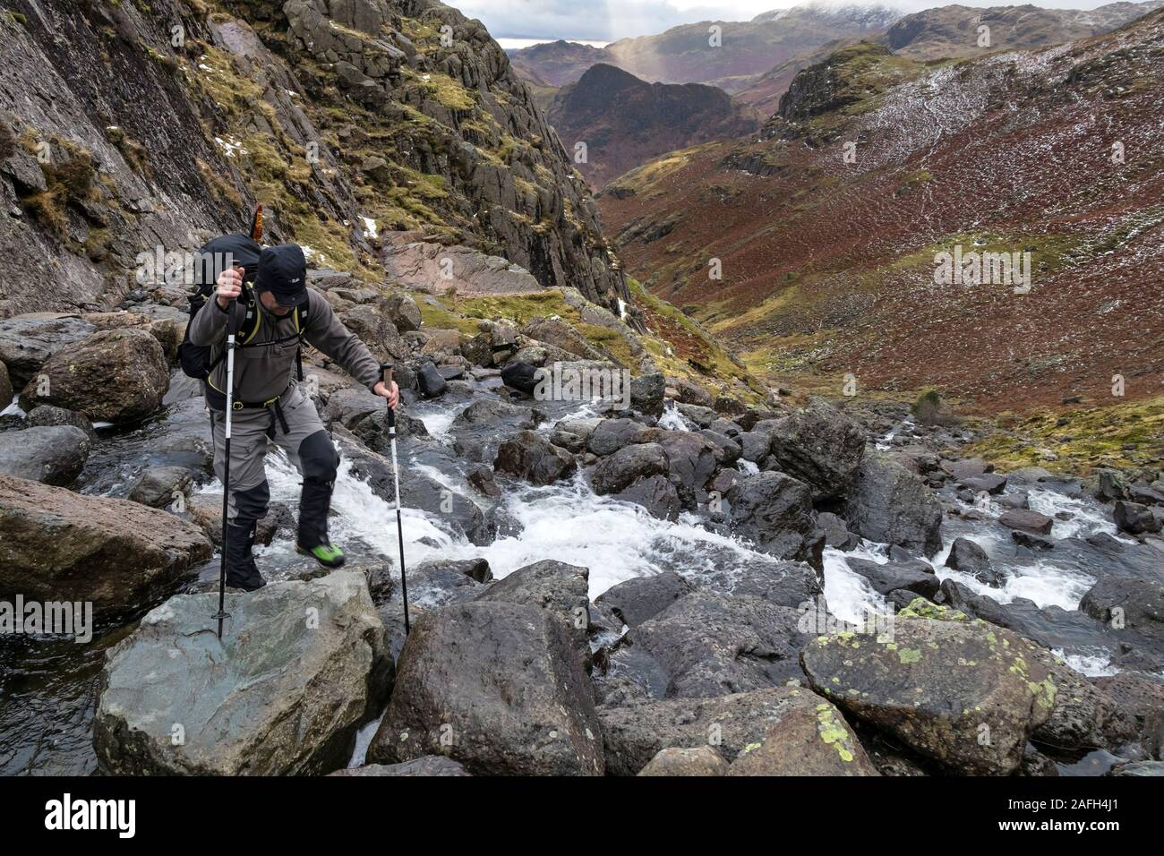Walker Crossing Stickle Ghyll, Great Langdale, Lake District, Cumbria, UK Stock Photo