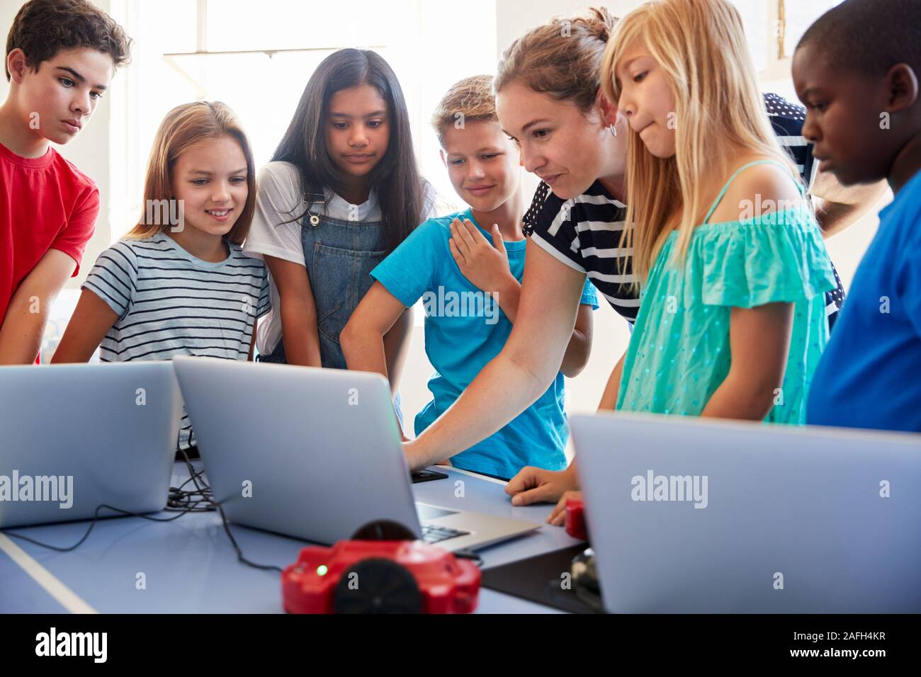 Group Of Students In After School Computer Coding Class Learning To ...