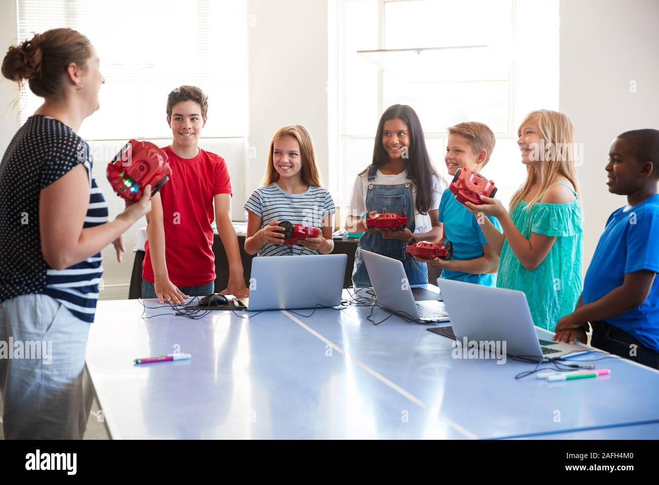 Group Of Students In After School Computer Coding Class Learning To ...