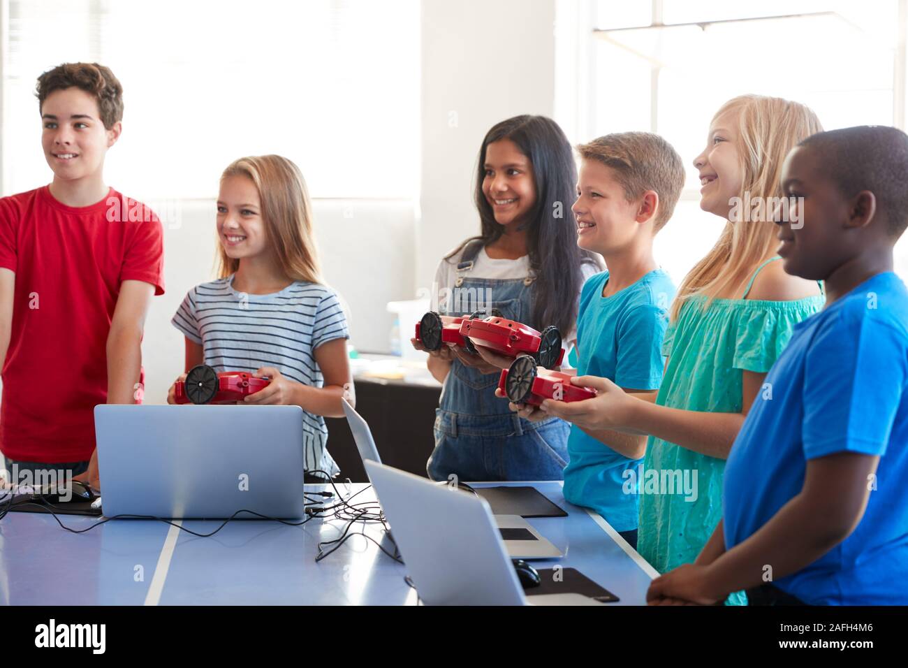 Group Of Students In After School Computer Coding Class Learning To ...
