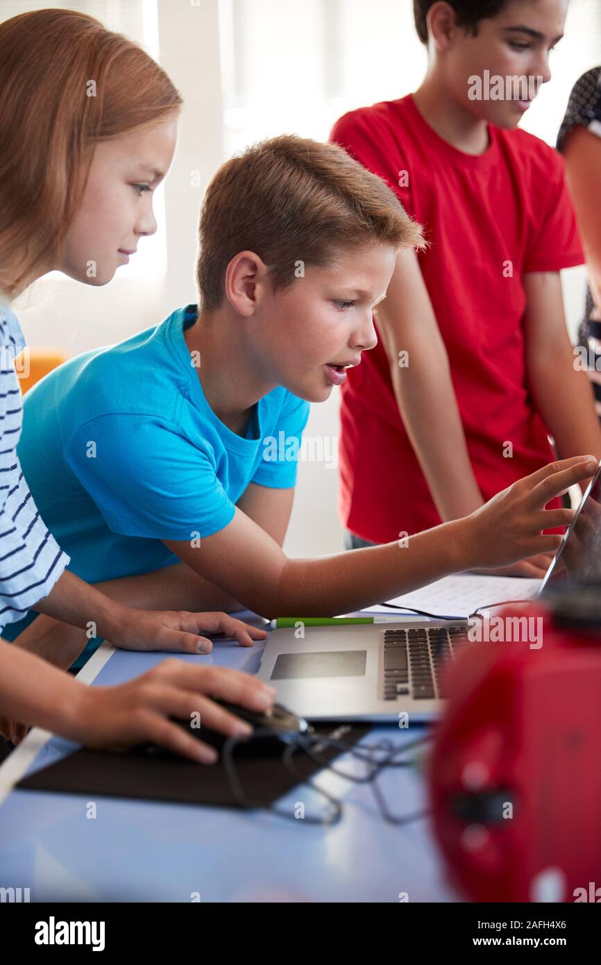 Group Of Students In After School Computer Coding Class Learning To ...