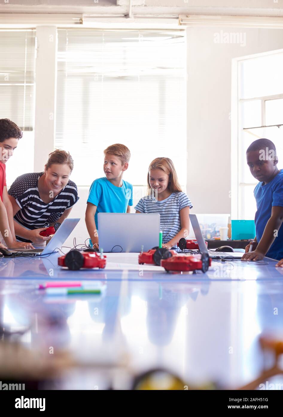 Group Of Students In After School Computer Coding Class Learning To ...