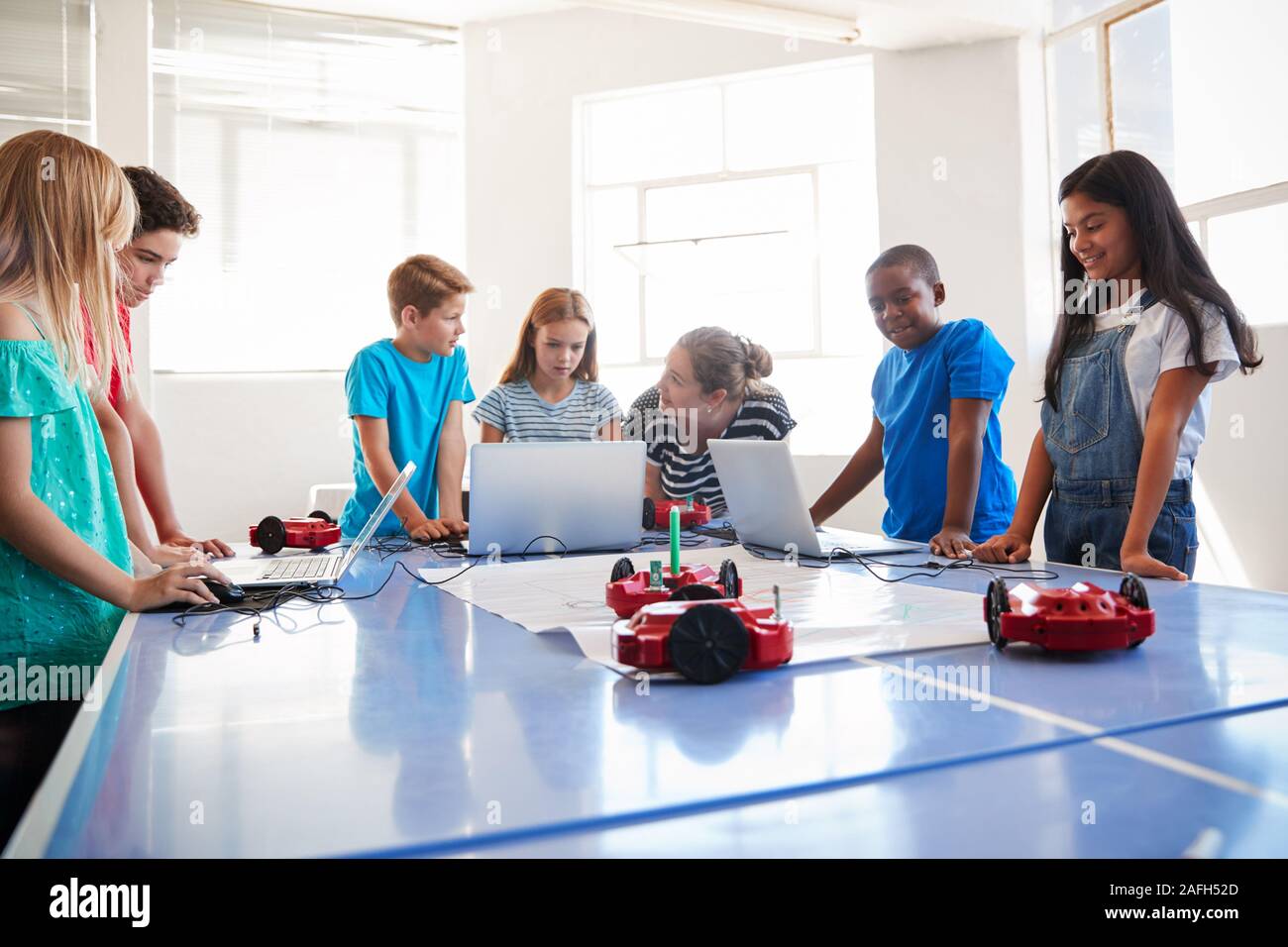 Group Of Students In After School Computer Coding Class Learning To ...