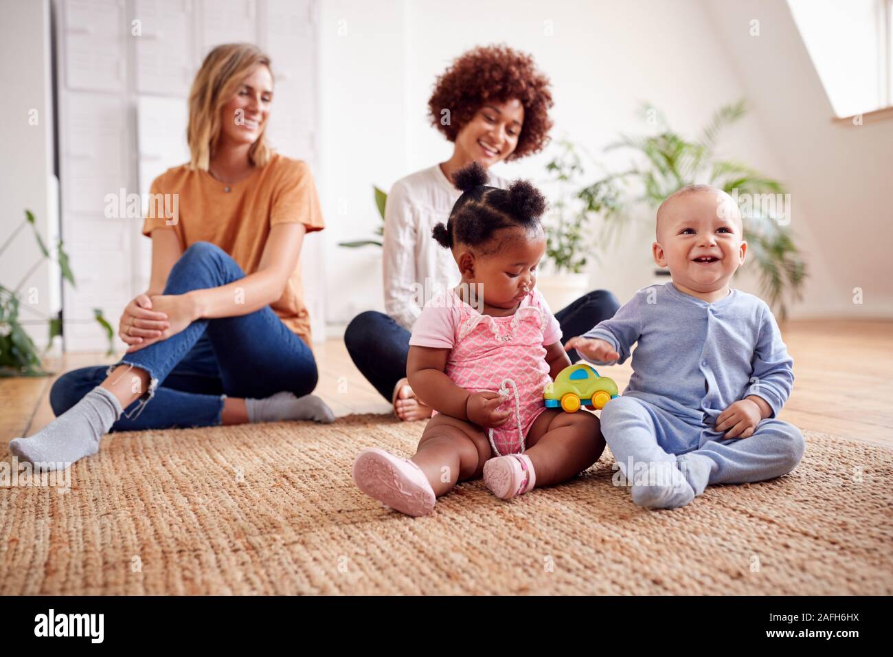 Two Mothers Meeting For Play Date With Babies At Home In Loft Apartment Stock Photo Alamy Two Mothers Meeting For Play Date With Babies At Home In Loft Apartment Stock Photo Alamy