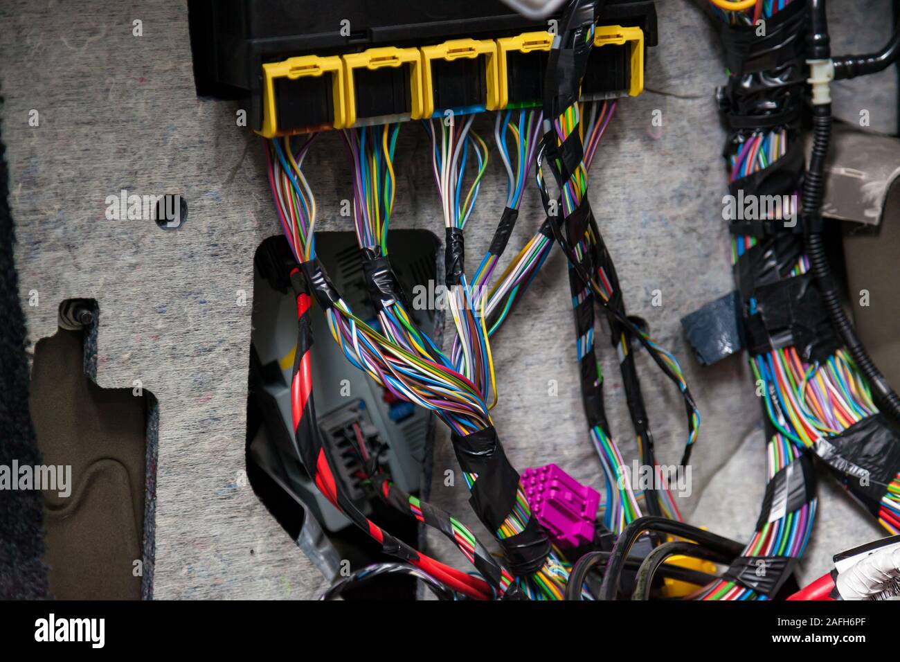 Large wide cable with multicolored red and green wires and connectors