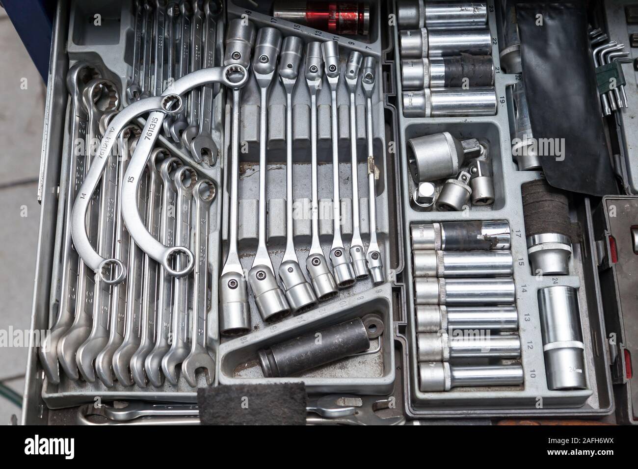 A set of tools from wrenches and heads for unscrewing nuts and bolts in